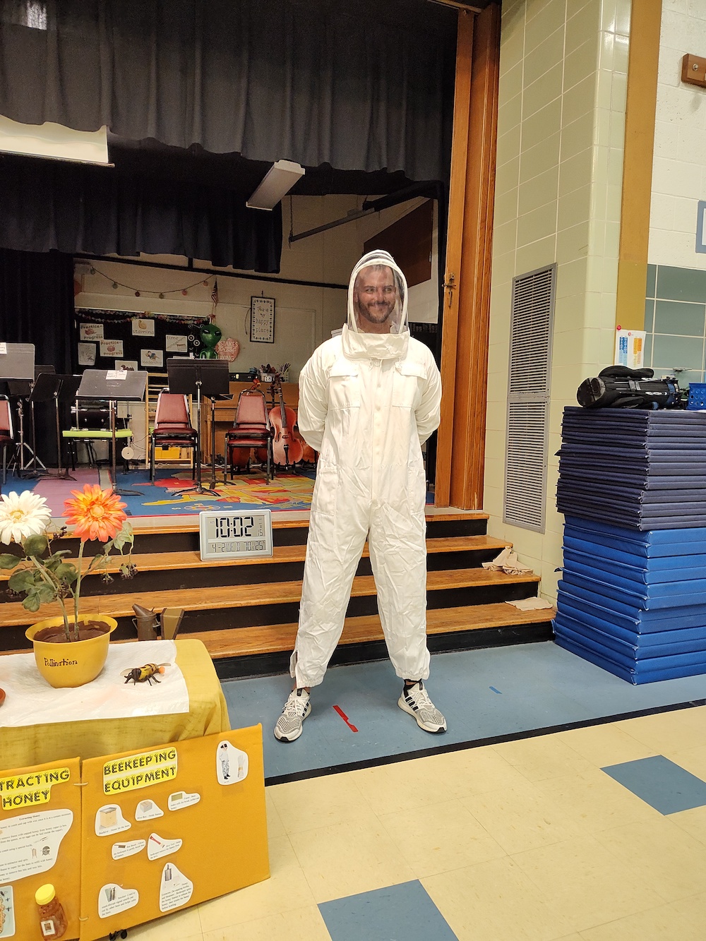 Vice principal in a bee suit for SBA educational presentation