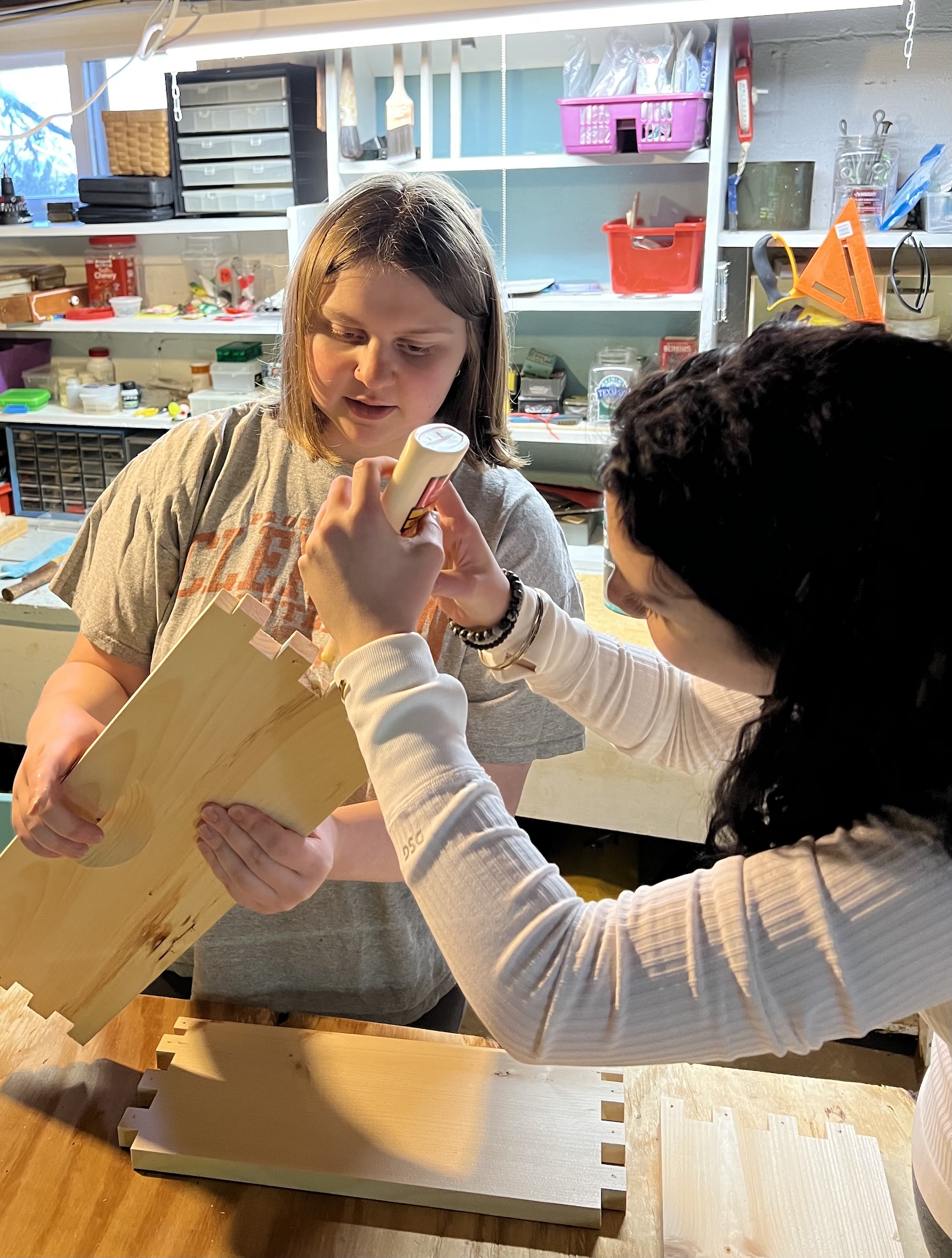 Young beekeepers assembling a hive body