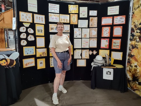 SBA Member Rita with her Education Wall